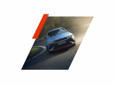 Front view of the all-electric Hyundai IONIQ 5 N driving through a curve.