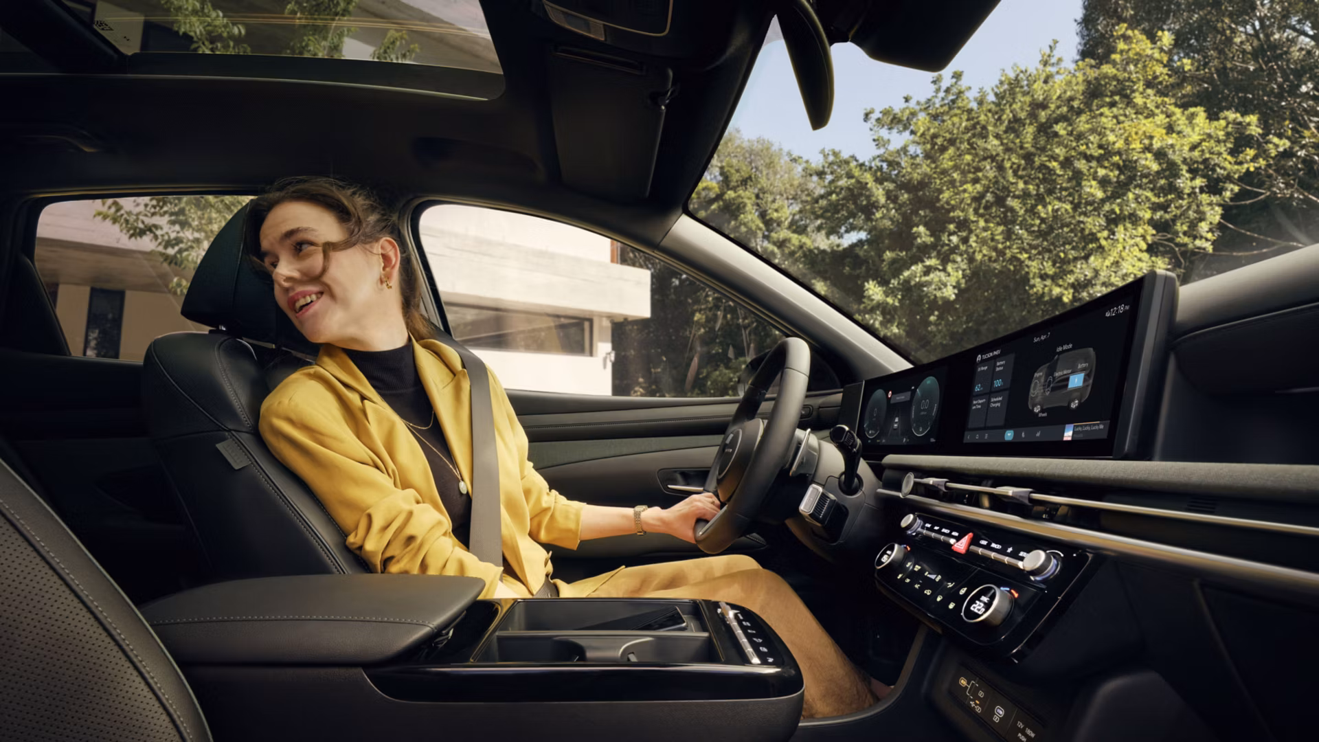A woman driving the Hyundai TUCSON Plug-in Hybrid.